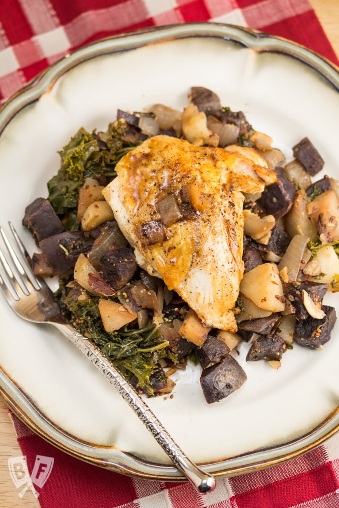 Seared Chicken with Sautéed Purple Potatoes, Kale & Apple: A simple, rich pan sauce is the perfect finish for this comfort food dinner.