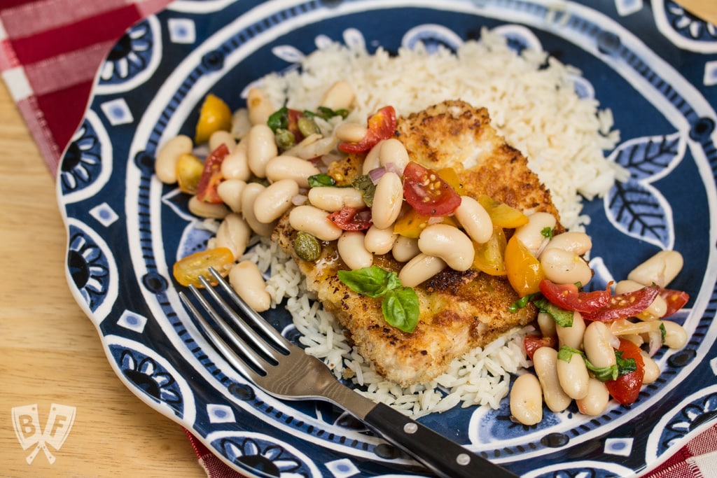 Pork Scallopini with White Bean-Tomato Salad: Need a quick weeknight dinner? Thin cut pork is coated in panko and fried till crispy, then topped with a vibrant salad that comes together in under 20 minutes! A perfect use for canned white beans!