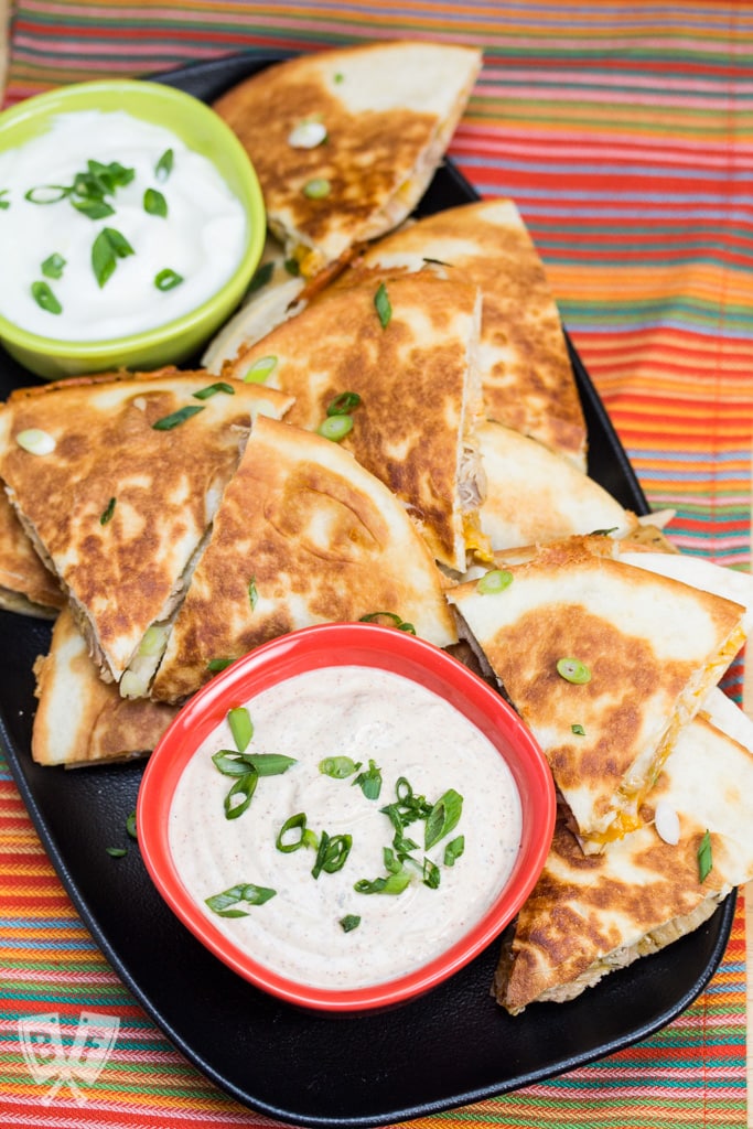 Chicken Quesadillas with Chipotle Ranch Dip: Simply seasoned chicken thighs are cooked in the Instant Pot till tender, then shredded + sandwiched between 2 types of cheese in this delicious recipe. #StonyfieldBlogger #OrganicMoments #ad