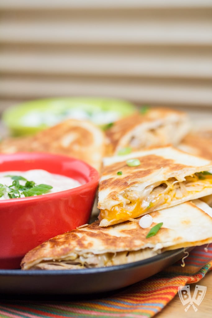 Chicken Quesadillas with Chipotle Ranch Dip: Simply seasoned chicken thighs are cooked in the Instant Pot till tender, then shredded + sandwiched between 2 types of cheese in this delicious recipe. #StonyfieldBlogger #OrganicMoments #ad