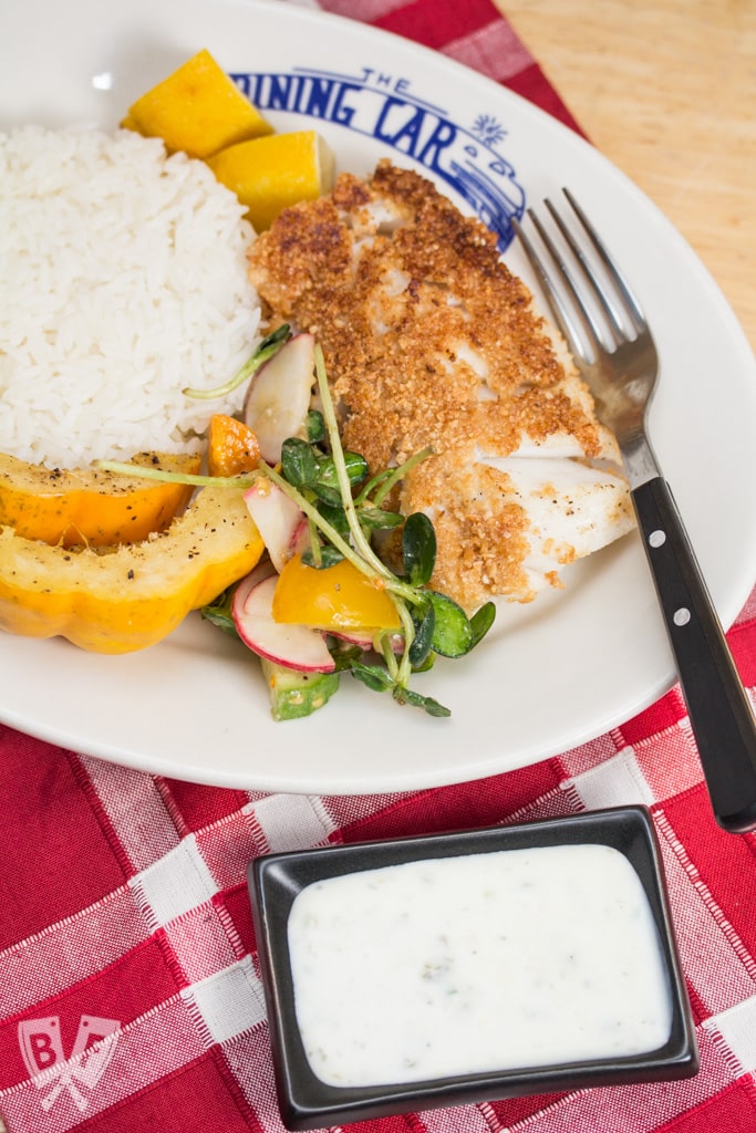 Lemony Almond Crusted Cod with Homemade Mayo-Free Tartar Sauce: Cod is coated with ground almonds and pan fried till beautifully flaky & tender in this delicious seafood recipe. Serve with my easy homemade tartar sauce! #StonyfieldBlogger #ad