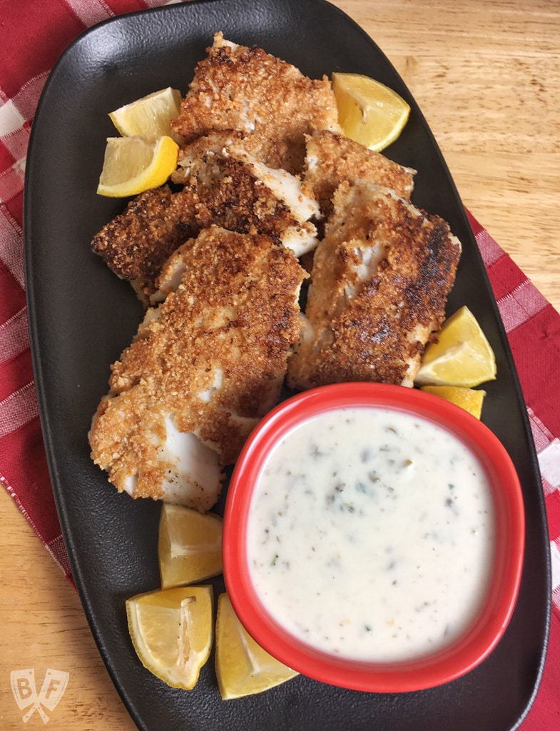 Lemony Almond Crusted Cod with Homemade Mayo-Free Tartar Sauce: Cod is coated with ground almonds and pan fried till beautifully flaky & tender in this delicious seafood recipe. Serve with my easy homemade tartar sauce! #StonyfieldBlogger #ad