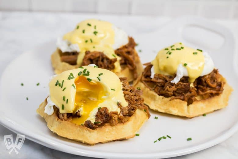 Thick, fluffy waffles are the perfect base for this sweet-and-salty BBQ pulled pork eggs Benedict topped with blender hollandaise sauce. #LeggoMyEggo #HearTheNews #CollectiveBias #ad