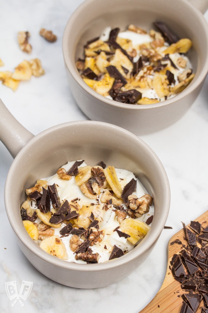 Chunky Monkey Greek Yogurt Parfaits: Chunks of premium dark chocolate, banana chips, toasted walnuts + a drizzle of honey bring these dessert-inspired breakfast parfaits to the next level! #StonyfieldBlogger #TheWholeYou #ad