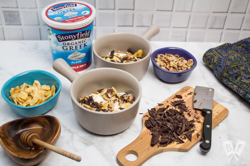 Chunky Monkey Greek Yogurt Parfaits: Chunks of premium dark chocolate, banana chips, toasted walnuts + a drizzle of honey bring these dessert-inspired breakfast parfaits to the next level! #StonyfieldBlogger #TheWholeYou #ad