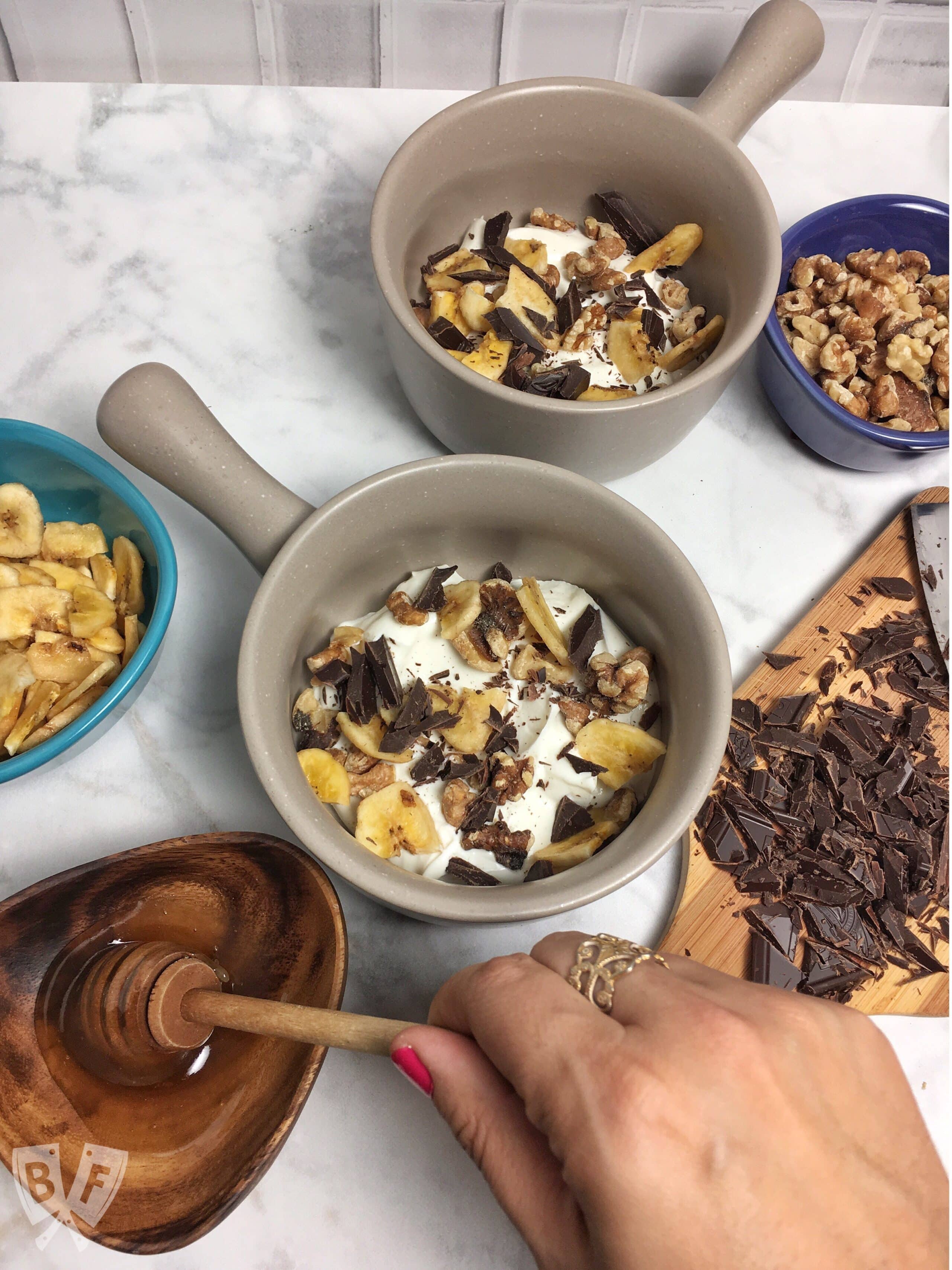 Chunky Monkey Greek Yogurt Parfaits: Chunks of premium dark chocolate, banana chips, toasted walnuts + a drizzle of honey bring these dessert-inspired breakfast parfaits to the next level! #StonyfieldBlogger #TheWholeYou #ad