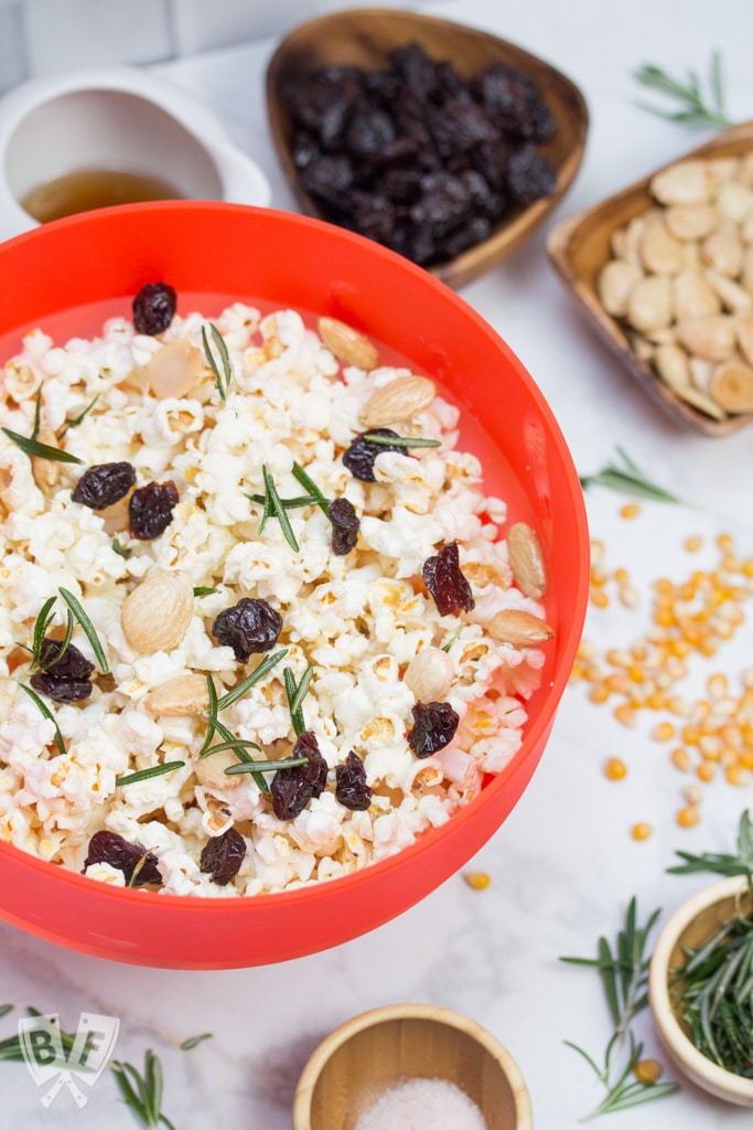 Marcona Almond + Dried Cherry Popcorn with Crispy Rosemary: Upgrade your date night with an upscale twist on classic movie theater popcorn. Make it right in the comfort of your own home with only 6 ingredients! #ad #popwithbarleans