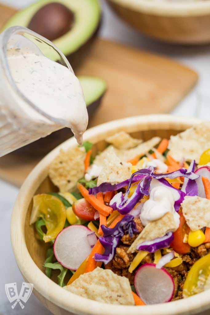 Taco Salad with Homemade Chipotle Ranch Dressing (#ad) is a healthier spin on Taco Tuesday that still packs lots of Mexican flavor. The homemade taco seasoning and chipotle ranch come together in a snap! #StonyfieldBlogger