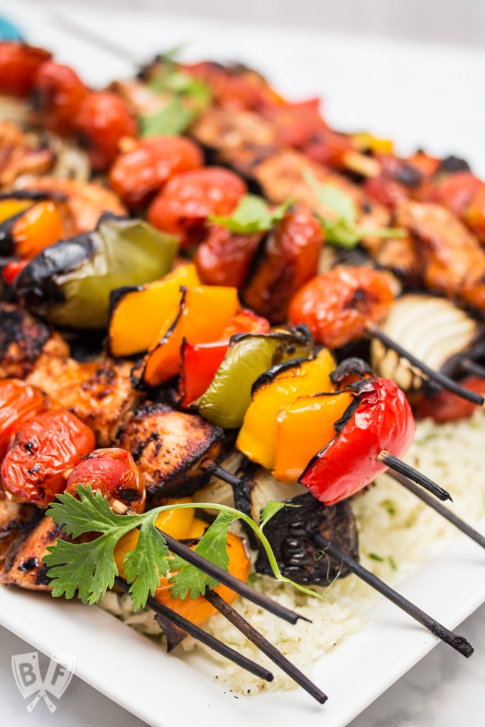 Chicken Fajita Skewers over Cilantro Cauliflower Rice: A rich, flavorful marinade makes these fajitas on a stick the perfect excuse to fire up the grill! Add a paleo side for a low carb summer meal! #OrganicMoments #ad