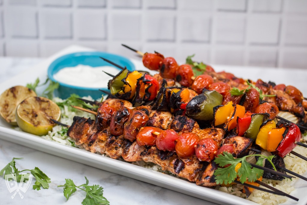 Chicken Fajita Skewers over Cilantro Cauliflower Rice: A rich, flavorful marinade makes these fajitas on a stick the perfect excuse to fire up the grill! Add a paleo side for a low carb summer meal! #OrganicMoments #ad