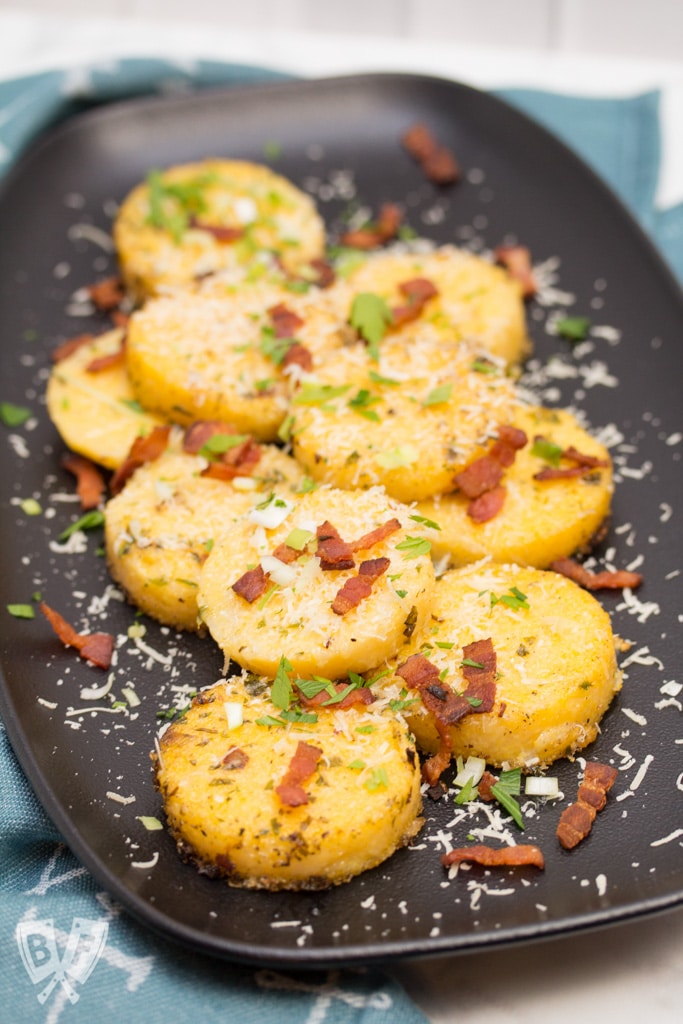 Big Shrimpin' Bacon-Wrapped Shrimp and Grit Cakes: Classic shrimp and grits gets an upscale makeover in this over-the-top, bacon-wrapped presentation. Easy, delicious, and sure to impress your dinner guests! #BaconMonth