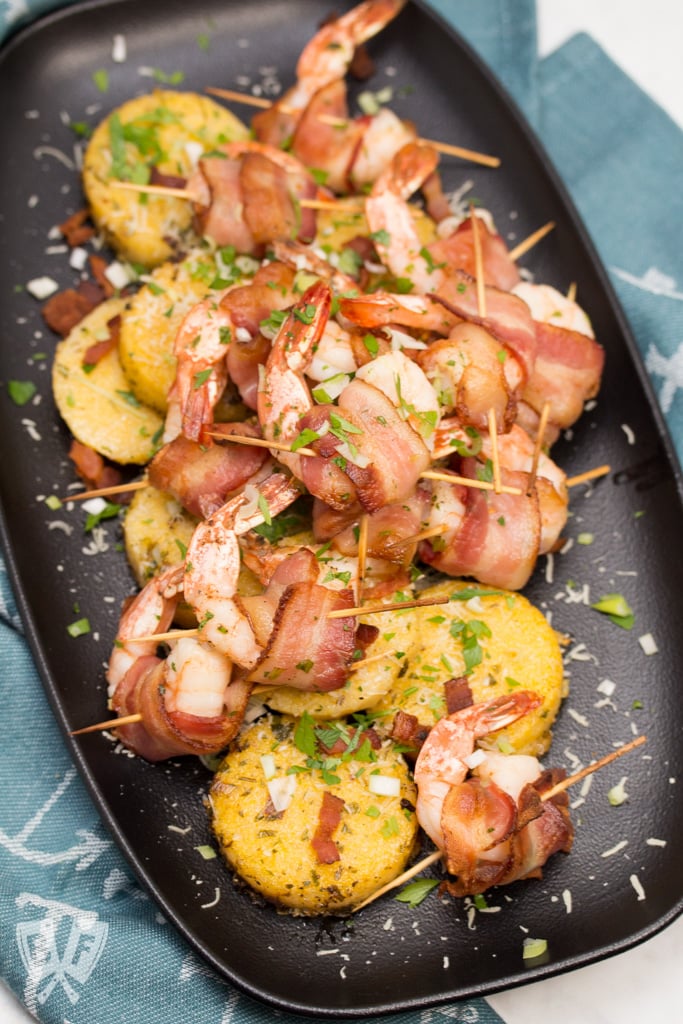 Big Shrimpin' Bacon-Wrapped Shrimp and Grit Cakes: Classic shrimp and grits gets an upscale makeover in this over-the-top, bacon-wrapped presentation. Easy, delicious, and sure to impress your dinner guests! #BaconMonth