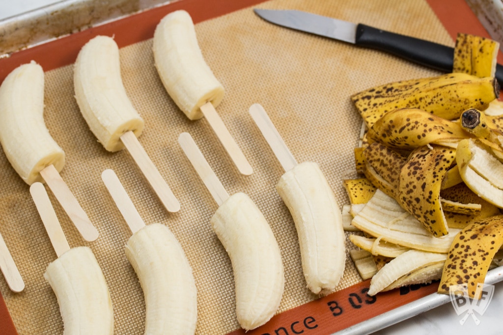 Elvis-Style Frozen Bananas take the classic Elvis sandwich (peanut butter, banana + bacon) to a new level! This easy 3 ingredient frozen dessert is fit for The King! #BaconMonth