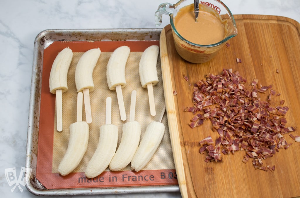 Elvis-Style Frozen Bananas take the classic Elvis sandwich (peanut butter, banana + bacon) to a new level! This easy 3 ingredient frozen dessert is fit for The King! #BaconMonth