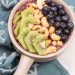 Surf Rider Smoothie Bowl: Green tea, raw cashews, kiwis and blueberries team up in this simple, delicious smoothie bowl. A vegan treat to start (or end!) any day of the week. Plus a review of Beautiful Smoothie Bowls by Carissa Bonham.