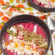 Overhead view of Tropical Superfruit Smoothie Bowls with colorful toppings.