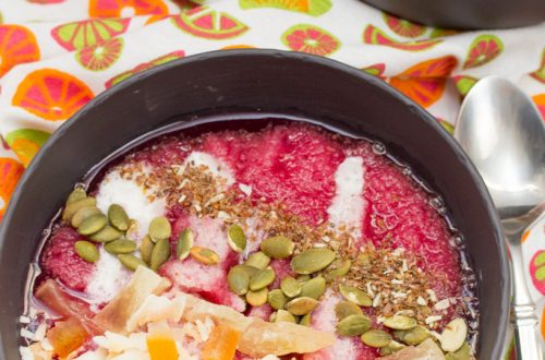 Overhead view of Tropical Superfruit Smoothie Bowls with colorful toppings.