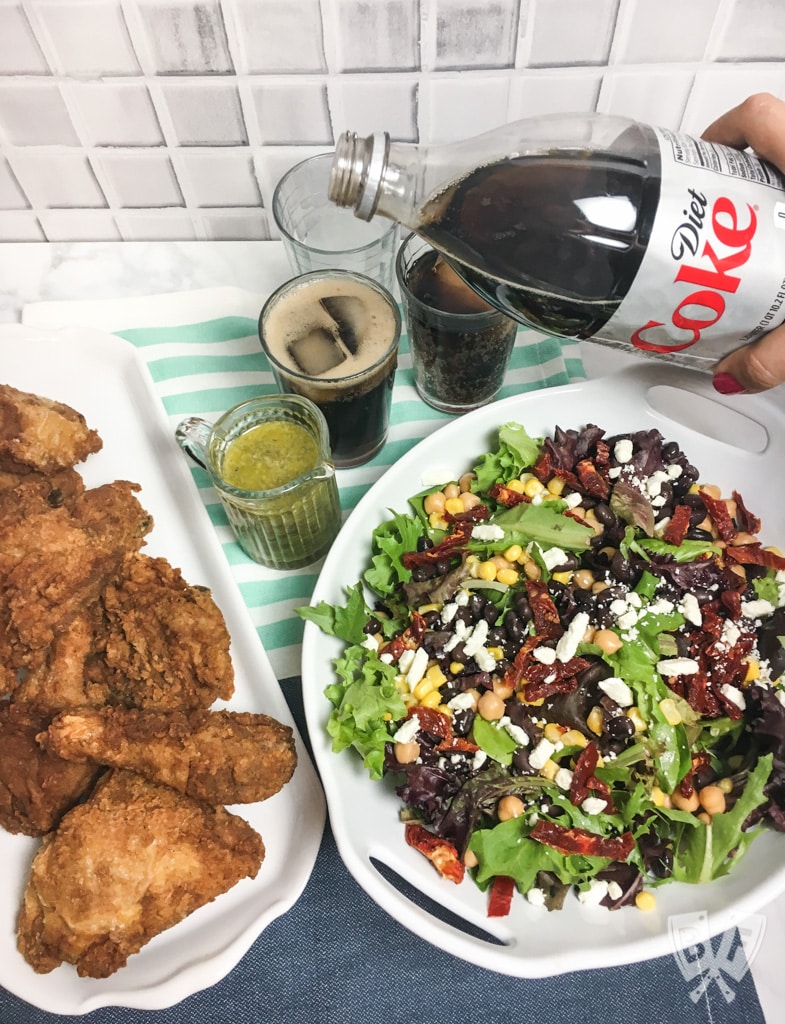 (#ad) Roma Salad with Caper-Dill Vinaigrette: Chickpeas, corn, black beans, feta cheese, + sun-dried tomatoes turn salad greens into a deliciously filling meal. Top it with a tangy homemade vinaigrette! #CookingWithCoke #CollectiveBias