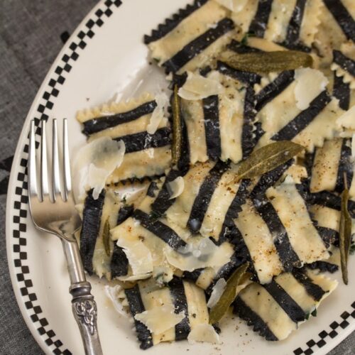 Ghost with the Most Roasted Sweet Potato Ravioli: Homemade black + white pasta is stuffed with roasted veggies, topped with brown butter sauce & crispy sage leaves in my Halloween tribute to Beetlejuice!