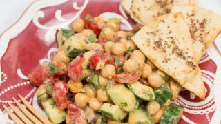 Plate of Falafel-Spiced Chickpea Salad with Tahini-Lemon Vinaigrette and a fork.