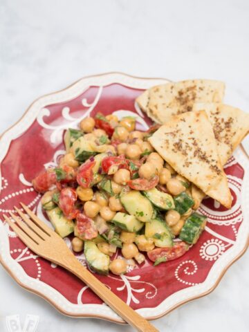 Plate of Falafel-Spiced Chickpea Salad with Tahini-Lemon Vinaigrette and a fork.