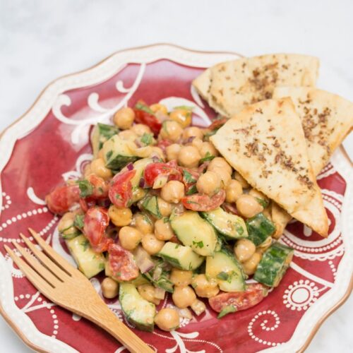 Plate of Falafel-Spiced Chickpea Salad with Tahini-Lemon Vinaigrette and a fork.