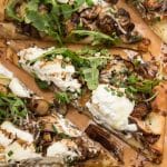 Garlicky Mushroom Ricotta Pizza with Wild Arugula + Aged Balsamic: Sautéed mushrooms are topped with ricotta and Parmesan cheeses and baked into a store-bought pizza crust for an easy, elegant weeknight meal!