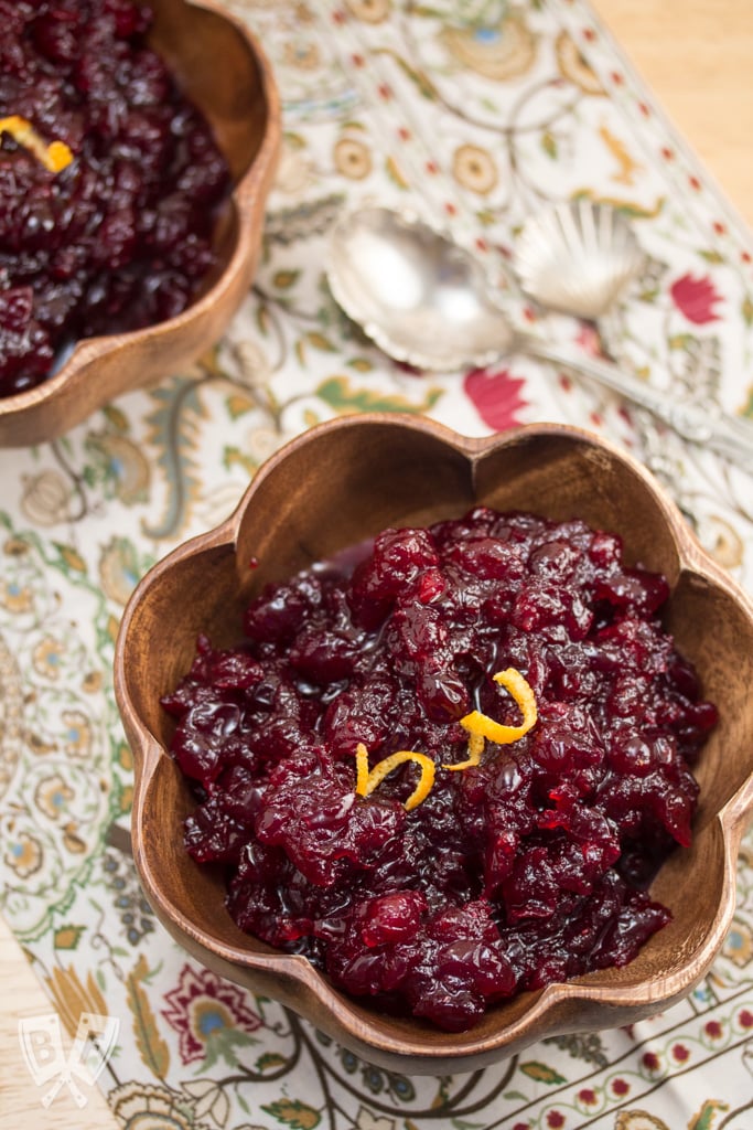 Bowls of cranberry sauce garnished with orange twists.