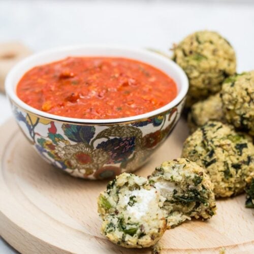 Goat Cheese-Stuffed Quinoa & Kale Balls with Romesco Sauce: (#ad) This hearty goat cheese-stuffed vegetarian "meatball" recipe with quick romesco sauce makes an elegant party appetizer or main course for Meatless Monday!