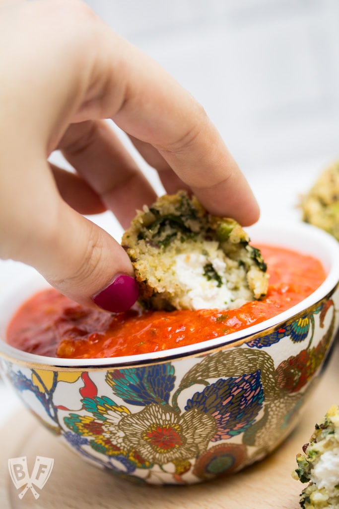 Goat Cheese-Stuffed Quinoa & Kale Balls with Romesco Sauce: (#ad) This hearty goat cheese-stuffed vegetarian "meatball" recipe with quick romesco sauce makes an elegant party appetizer or main course for Meatless Monday!