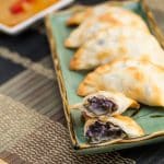 Cross-section of purple yam dumplings on a platter.