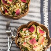 Bowls of salad with watermelon radishes.