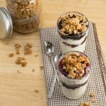 Parfait glasses layered with berries and homemade granola.