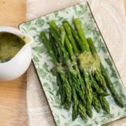 Overhead view of asparagus and hollandaise sauce.