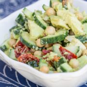 Bowl of Creamy Cucumber, Avocado, Chickpea, & Sun-Dried Tomato Salad.