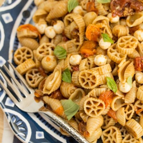Overhead view of balsamic roasted tomato Caprese pasta salad.