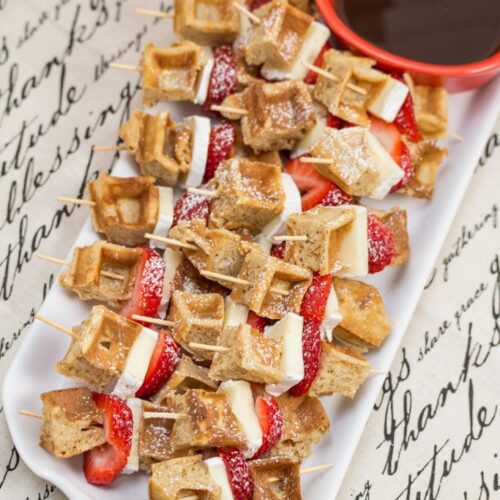 Brie Waffle Bites on a platter with maple syrup.