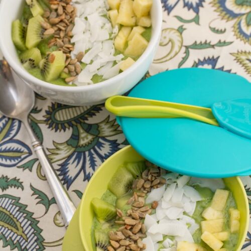Smoothie bowls topped with tropical fruits.
