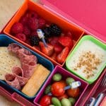Bento-style lunchbox filled with various toddler snacks.