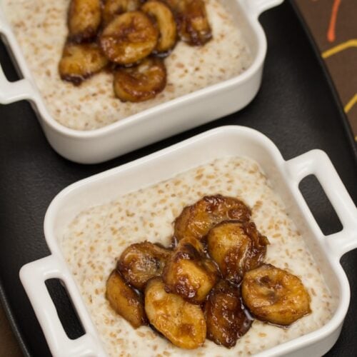 Overhead view of 2 bowls of caramelized banana breakfast porridge.