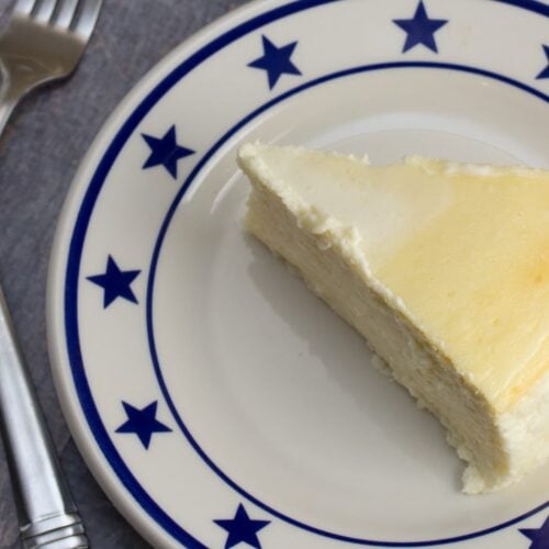 Overhead shot of a plate topped with a slice of Italian Cheesecake