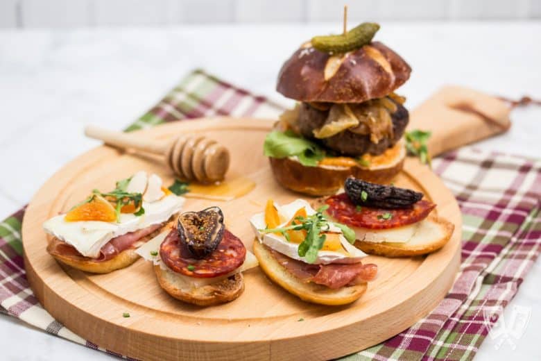 ¾ view of a board with an assortment of Spanish tapas.