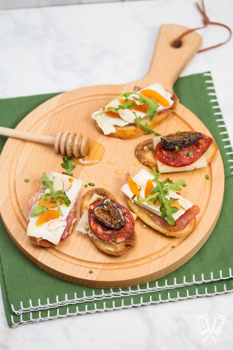 Overhead view of a board with an assortment of Spanish tapas.