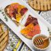 Overhead view of Goat Cheese Toast with Honeyed Citrus Fruit and ingredients around the sides.
