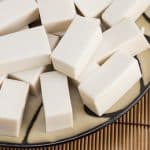 Overhead shot of a plate with rectangles of white coconut jelly.