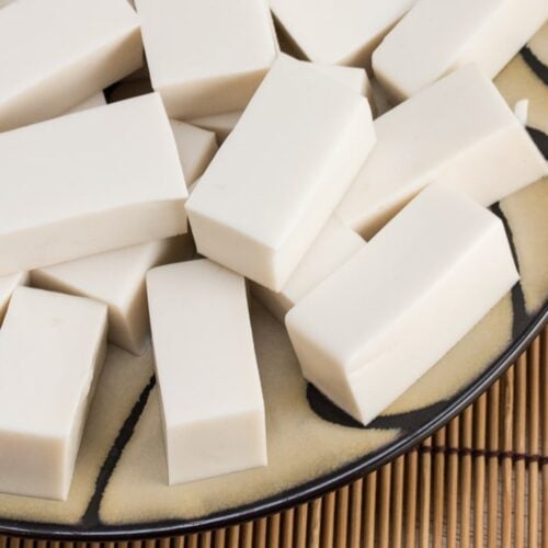 Overhead shot of a plate with rectangles of white coconut jelly.