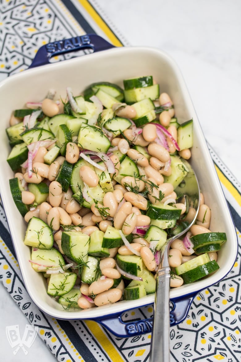 Overhead view of a dish of Cucumber & Cannellini Bean Salad with Dill