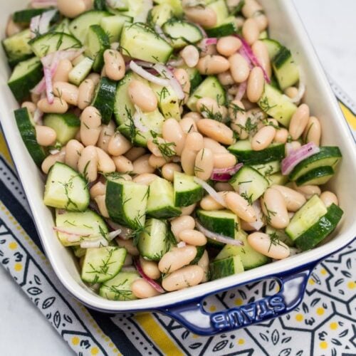 Overhead view of a dish of Cucumber & Cannellini Bean Salad with Dill