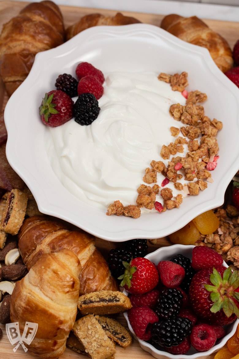 Overhead view of assorted breakfast items displayed on a board.