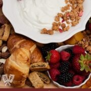 Overhead view of assorted breakfast items displayed on a board.